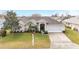 Single-story house with a nicely landscaped yard and driveway at 5470 Nw 26Th Lane, Ocala, FL 34482