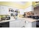 Kitchen with white cabinets, corner sink, and coffee station at 5470 Nw 26Th Lane, Ocala, FL 34482