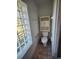 Small bathroom with toilet and a built-in cabinet at 6 Hickory Loop Way, Ocala, FL 34472