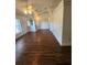 Spacious living room featuring a ceiling fan and wood-look vinyl flooring at 6 Hickory Loop Way, Ocala, FL 34472