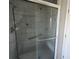 Walk-in shower with glass enclosure and grab bars at 6 Hickory Loop Way, Ocala, FL 34472