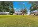 Expansive backyard with a view of the house and surrounding landscape at 6151 Sw 84Th St, Ocala, FL 34476