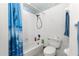 Bathroom with shower, toilet and blue shower curtain at 6151 Sw 84Th St, Ocala, FL 34476