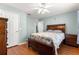 Spacious bedroom with wood flooring and ceiling fan at 6151 Sw 84Th St, Ocala, FL 34476