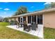 Relaxing patio with seating area and view of the backyard at 6151 Sw 84Th St, Ocala, FL 34476