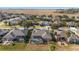 Aerial view of a residential community showcasing numerous homes and green spaces at 6839 Sw 97Th Terrace Rd, Ocala, FL 34481