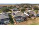 Aerial view of a home with pool and screened enclosure, near a tranquil marsh at 6839 Sw 97Th Terrace Rd, Ocala, FL 34481