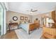 Bright bedroom with wood flooring and a ceiling fan at 6839 Sw 97Th Terrace Rd, Ocala, FL 34481