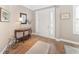 Elegant entryway with hardwood floors, decorative console table, and a view of the front door at 6839 Sw 97Th Terrace Rd, Ocala, FL 34481