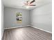 Bright bedroom with gray walls and wood-look floors at 7084 Se 124 St, Belleview, FL 34420