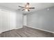 Simple bedroom with gray walls and wood-look floors at 7084 Se 124 St, Belleview, FL 34420