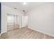 Well-lit bedroom with mirrored closet and wood-look floors at 7402 Sw 99Th Ave, Ocala, FL 34481