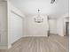 Elegant dining room with chandelier and wood-look flooring at 7402 Sw 99Th Ave, Ocala, FL 34481