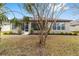 Single-story home with screened porch and landscaped yard at 7402 Sw 99Th Ave, Ocala, FL 34481