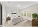 Main bedroom with wood floors and stylish decor at 7402 Sw 99Th Ave, Ocala, FL 34481