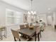 Bright dining room with a dark wood table and six chairs at 7752 Sw 96Th Avenue Rd, Ocala, FL 34481