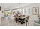 Kitchen and dining area with a table for six and white cabinets at 7752 Sw 96Th Avenue Rd, Ocala, FL 34481