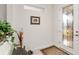 Inviting entryway featuring a glass front door and decorative rug at 7752 Sw 96Th Avenue Rd, Ocala, FL 34481