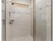 Modern shower with neutral tile and glass enclosure at 7752 Sw 96Th Avenue Rd, Ocala, FL 34481