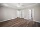 Main bedroom with vinyl plank flooring and access to bathroom at 8 Juniper Track Dr, Ocala, FL 34480