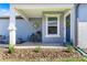 Inviting front porch with seating area and decorative accents at 8332 Sw 54Th Loop, Ocala, FL 34481