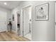 Light-colored hallway with wood-look floors and access to rooms at 8332 Sw 54Th Loop, Ocala, FL 34481