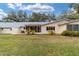 Nice backyard view of the home's exterior and screened patio at 8540 Sw 90Th Pl # B, Ocala, FL 34481