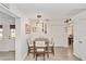 Casual breakfast nook with wood table and light-colored chairs at 8540 Sw 90Th Pl # B, Ocala, FL 34481