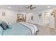 Spacious main bedroom with king-size bed and en-suite bathroom access at 8540 Sw 90Th Pl # B, Ocala, FL 34481