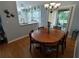 Bright dining room with hardwood floors and kitchen view at 8623 Sw 108Th Place Rd, Ocala, FL 34481