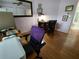 Home office featuring hardwood floors, a desk, and a comfortable chair at 8623 Sw 108Th Place Rd, Ocala, FL 34481