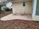 Brick patio with two chairs and side yard view at 8623 Sw 108Th Place Rd, Ocala, FL 34481