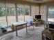 Sunroom with tiled floor, table, chairs, and view of backyard at 8623 Sw 108Th Place Rd, Ocala, FL 34481