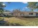 Spacious backyard with grassy lawn and mature trees at 8671 Sw 97Th St # C, Ocala, FL 34481