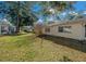 Large backyard with grassy area and mature trees at 8671 Sw 97Th St # C, Ocala, FL 34481