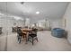 Dining area with oval table, chandelier, and mirrored wall at 8671 Sw 97Th St # C, Ocala, FL 34481