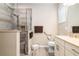 Main bathroom with walk-in shower, double vanity, and toilet at 8878 Sw 103Rd Cir, Ocala, FL 34481