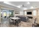 Open concept dining area with modern table and chairs, adjacent to living room and kitchen at 8878 Sw 103Rd Cir, Ocala, FL 34481