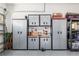 Garage with built-in storage cabinets and work bench at 8878 Sw 103Rd Cir, Ocala, FL 34481