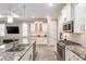 Spacious kitchen featuring granite countertops and custom cabinetry at 8878 Sw 103Rd Cir, Ocala, FL 34481