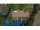 Aerial view of building with parking and private patios at 11001 Se Sunset Harbor Rd # E 33, Summerfield, FL 34491