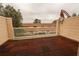 Comfortable private balcony with brick flooring and community views at 11001 Se Sunset Harbor Rd # E 33, Summerfield, FL 34491