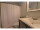 Clean bathroom with a shower/tub combo and dark vanity at 11001 Se Sunset Harbor Rd # E 33, Summerfield, FL 34491