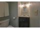 Bathroom with a modern vanity and lighting fixtures at 11001 Se Sunset Harbor Rd # E 33, Summerfield, FL 34491