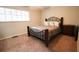 Cozy bedroom with a comfortable bed and natural light coming through the windows at 11001 Se Sunset Harbor Rd # E 33, Summerfield, FL 34491
