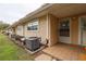 Charming townhome featuring neutral siding, well-kept landscaping, and convenient front door access at 11001 Se Sunset Harbor Rd # E 33, Summerfield, FL 34491