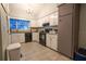 White cabinet kitchen with modern appliances and granite countertops at 11001 Se Sunset Harbor Rd # E 33, Summerfield, FL 34491
