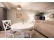 Cozy living area with a round dining table and neutral tones at 11001 Se Sunset Harbor Rd # E 33, Summerfield, FL 34491