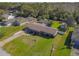 Aerial view of a single Gathering home with a large backyard and pool at 11418 Lake Eustis Dr, Leesburg, FL 34788