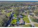 Aerial view showing home, pool, and waterfront access at 11418 Lake Eustis Dr, Leesburg, FL 34788
